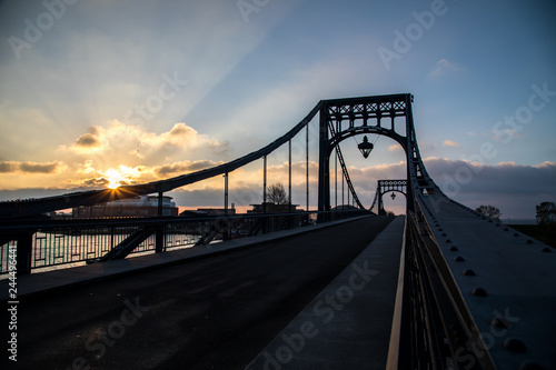 Kaiser-Wilhelm-Bridge a rotatable steel car bridge and landmark in Wilhelmshaven Germany during sunrise