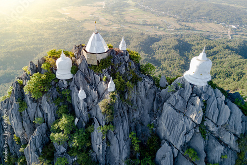 Spectacular aerial view of floating pagodas on the mountain cliff at Wat Chaloem Phra Kiat in Chae Hom District, Lampang province, Thailand. photo