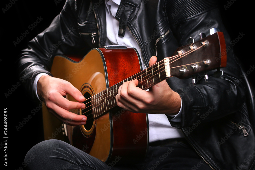 Fototapeta premium Young men playing the guitar