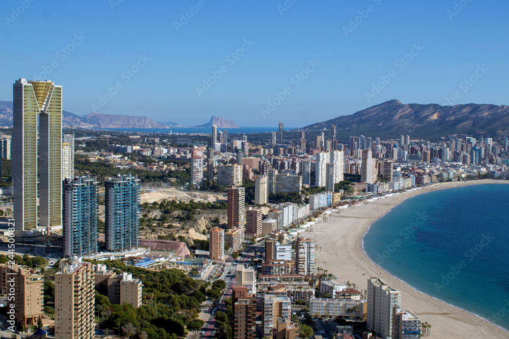 Naklejka premium Aerial photo showing the whole of Benidorm in Alicante, you can see everywhere included Playa de Levante beach, Balcón del Mediterráneo and all the high rise hotels.