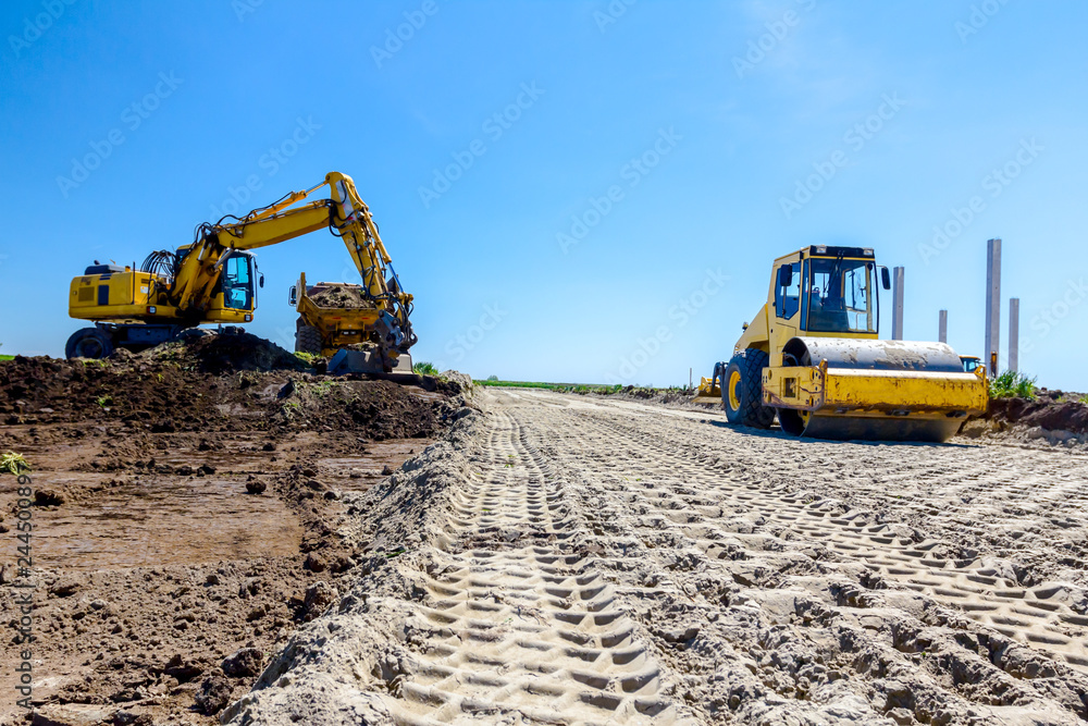 Obraz premium Trace of huge road roller with spikes to compact soil at construction site