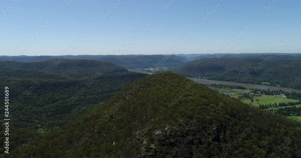 High mountain top covered by evergreen gum-tree woods above Hawkesbury river flowing pass Wisemans ferry town in Greater Sydney area of Australia.
High mountain top covered by evergreen gum-tree woods above Hawkesbury river flowing pass Wisemans ferry town in Greater Sydney area of Australia.