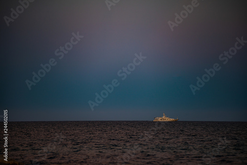 superyacht in navigazione - running a sunset photo