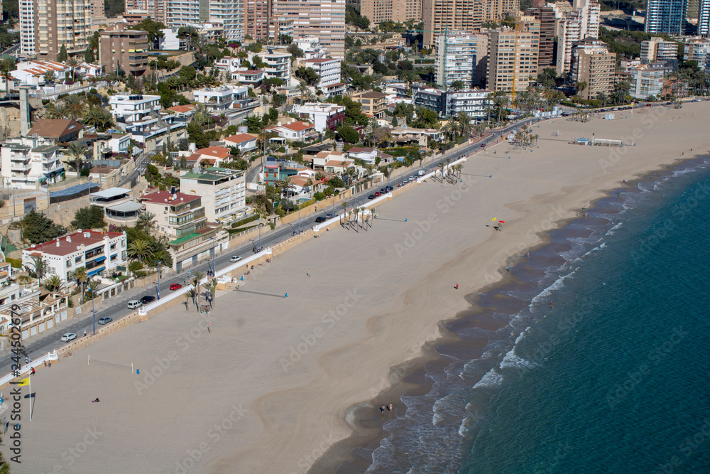 Aerial photo taken in Benidorm in Spain Alicante, showing the beautiful beach of Playa Levante and hotels, buildings, and high rise skyline cityscape.