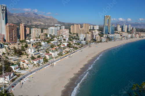 Aerial photo taken in Benidorm in Spain Alicante, showing the beautiful beach of Playa Levante and hotels, buildings, and high rise skyline cityscape.