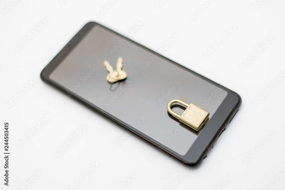 Electronic security and data protection concept. Mobile phone and key lock. Electronic security and data protection concept. Mobile phone and key lock.