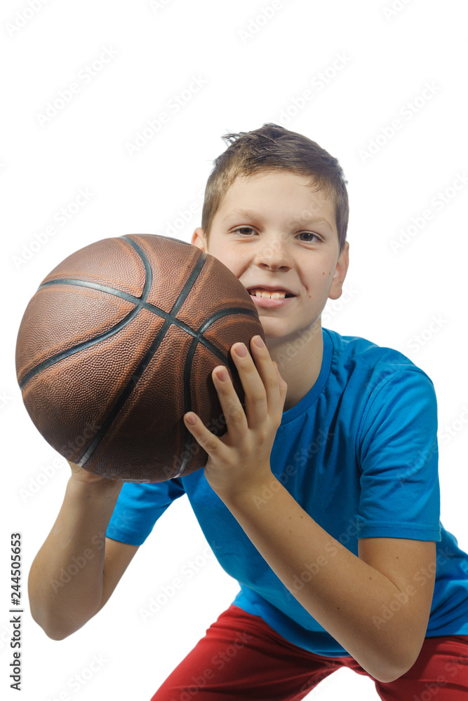 A boy with a basketball ball, isolate, gonna throw the ball, looking at the camera A boy with a basketball ball, isolate, gonna throw the ball, looking at the camera