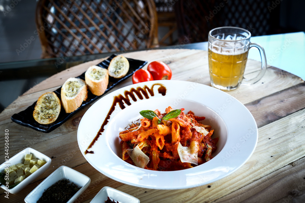 Pork with one glass of beer in wooden texture Pork with one glass of beer in wooden texture