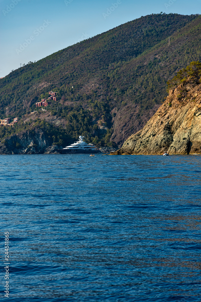 Superyacht at anchor in a bay along the Ligurian Coast