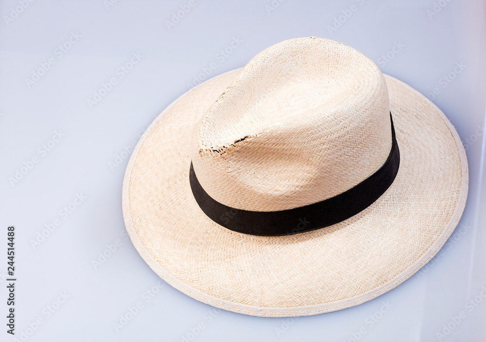 Traditional Antioquian hat - Traditional hat made of the palm of Iraca. Wooden background
