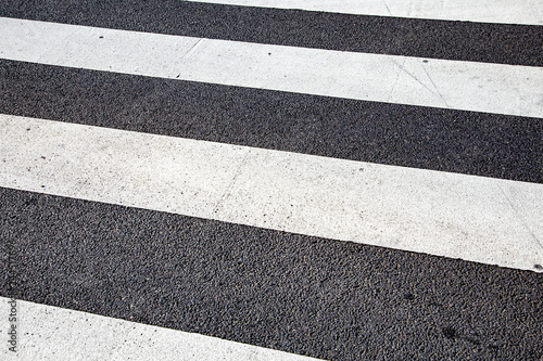 detail of pedestrian crossing marker at street scalled zebra strip