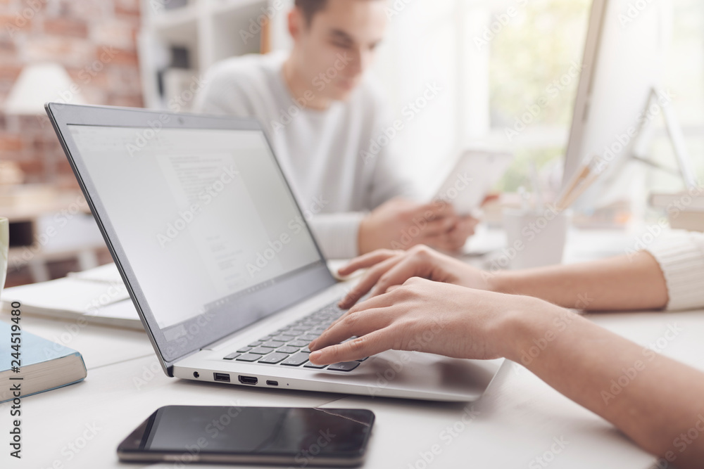 Woman using a laptop and connecting Woman using a laptop and connecting