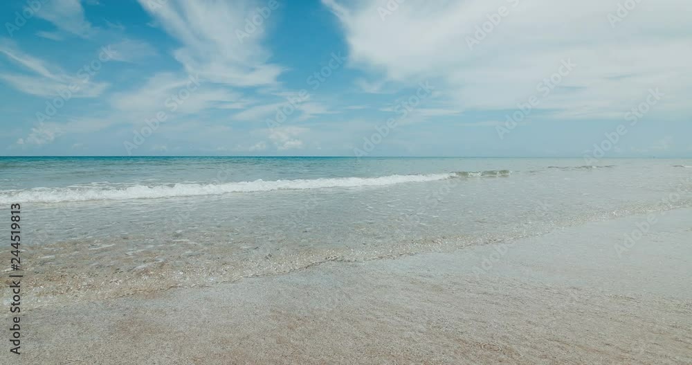 fresh and sunny day with tropical  seascape  beach of  thailand with a wave crashing on sandy shore , 4K Dci resolution