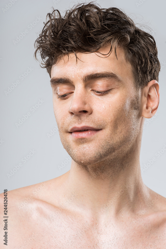 Obraz premium portrait of sexy young man isolated on grey