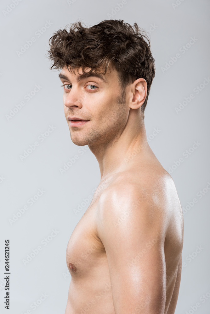 portrait of handsome young brunette man isolated on grey portrait of handsome young brunette man isolated on grey