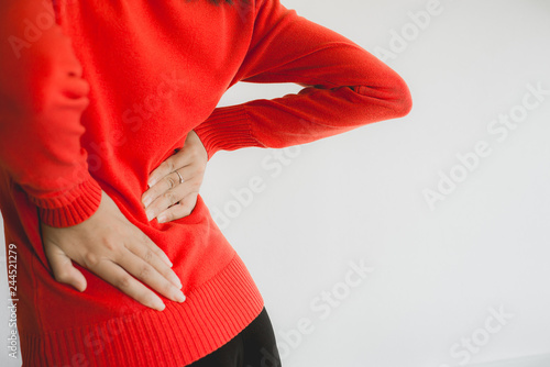 Woman with lower back pain,Female suffering from backache © gballgiggs