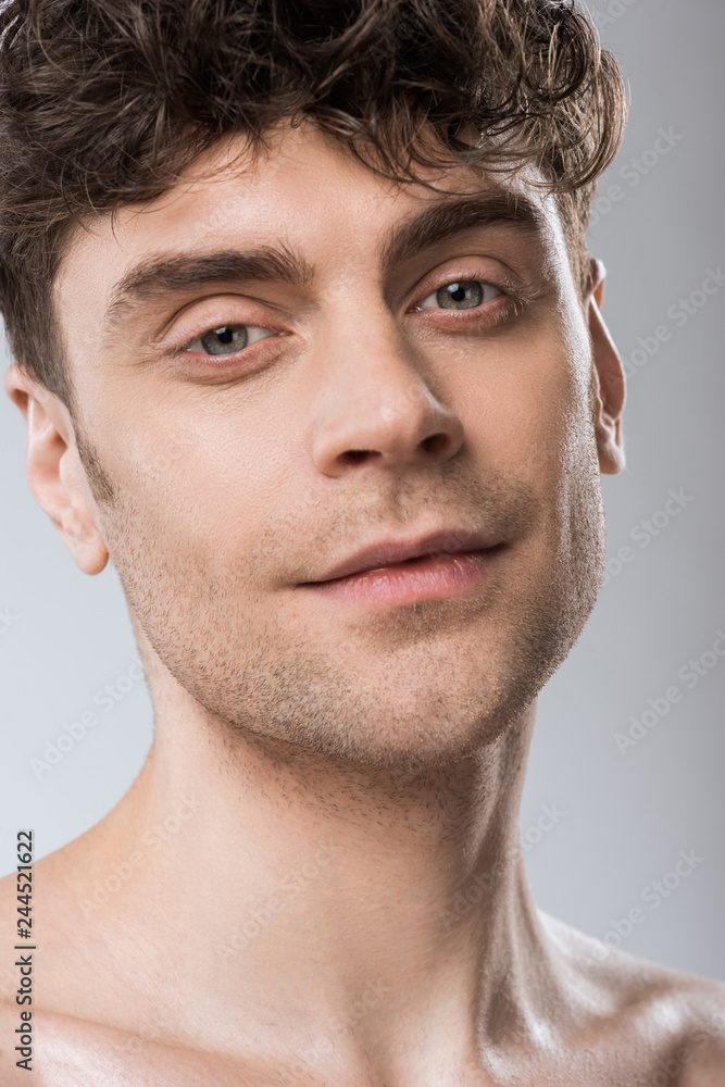 Obraz premium portrait of handsome young man isolated on grey