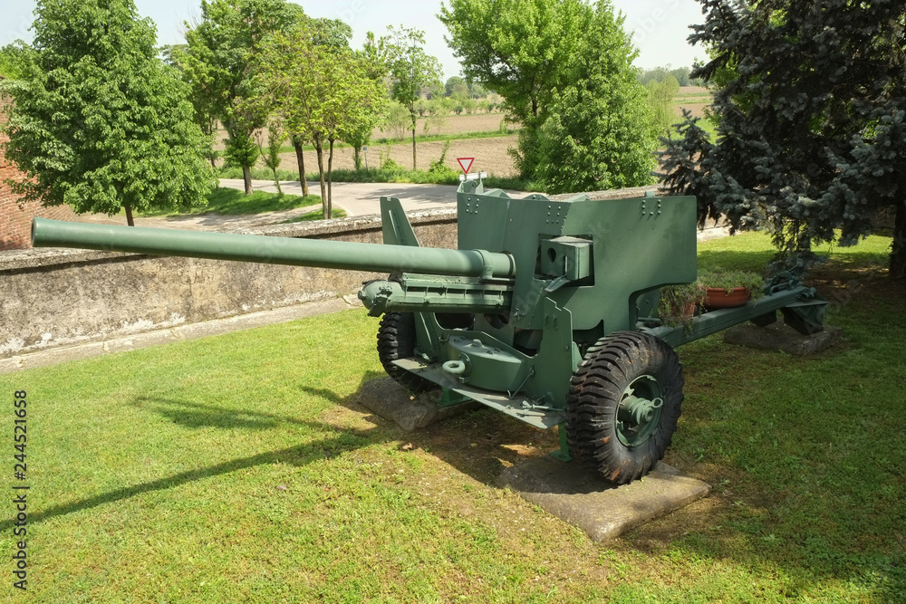 Fototapeta premium Gun near medieval castle walls in Soncino, Italy