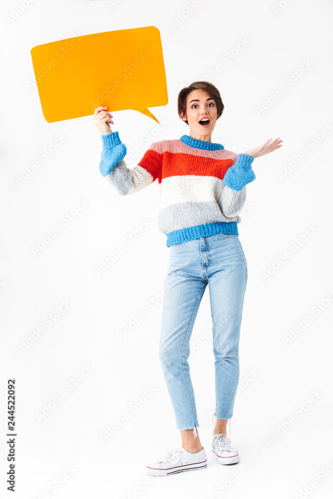 Happy cheerful girl wearing sweater standing Happy cheerful girl wearing sweater standing