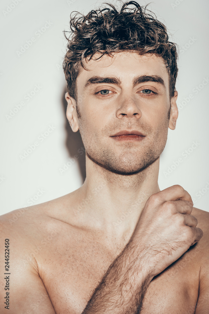 Fototapeta premium portrait of handsome young man on grey