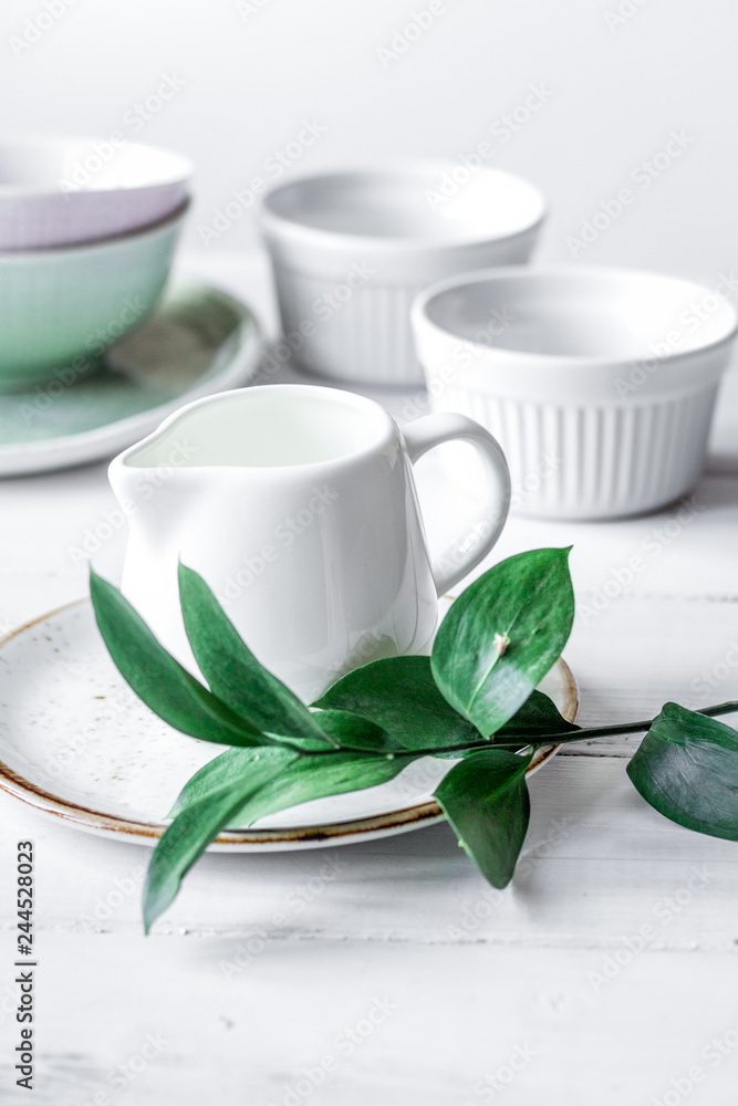 ceramic tableware with flowers on white background ceramic tableware with flowers on white background