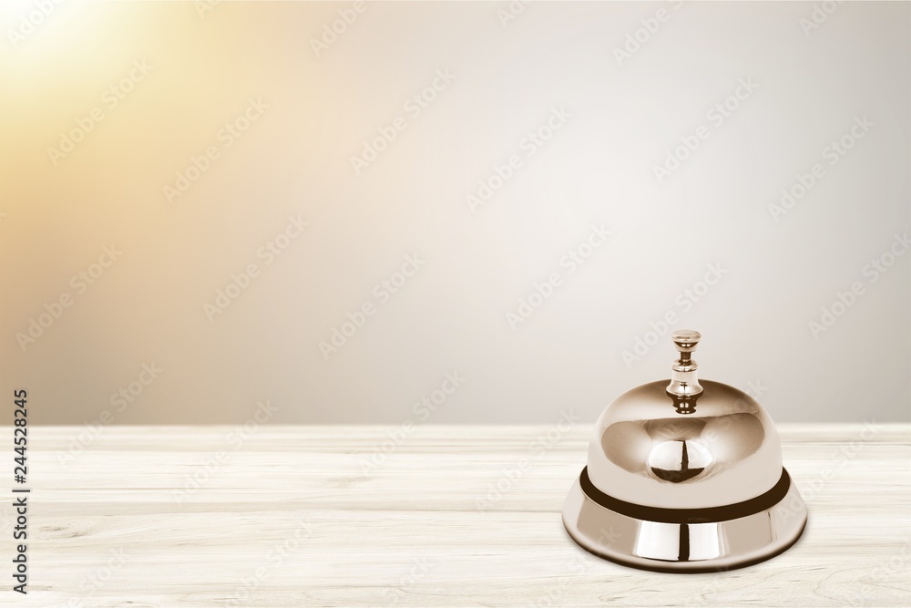 Reception service desk bell on light background