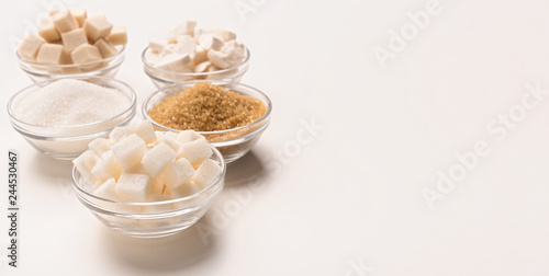 Fotografie Various kinds of sugar cubes, pieces ands sand