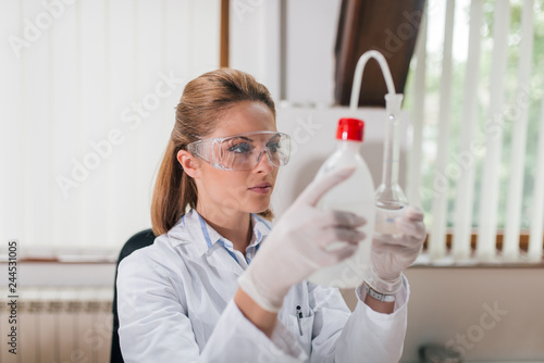 Female scientist conducting water quality research.