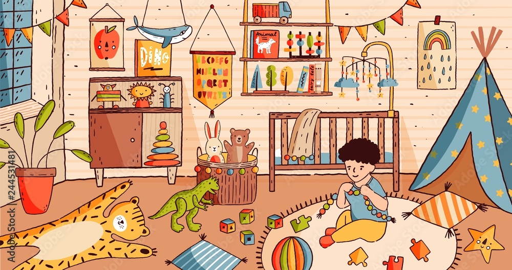 Cute little boy sitting on floor of baby room and playing with toys. Child  in nursery