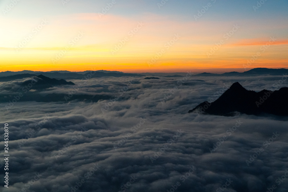 sunrise and sea of fog view on phu chi fa mountain area and national forest park in chiang rai, Thailand. sunrise and sea of fog view on phu chi fa mountain area and national forest park in chiang rai, Thailand.