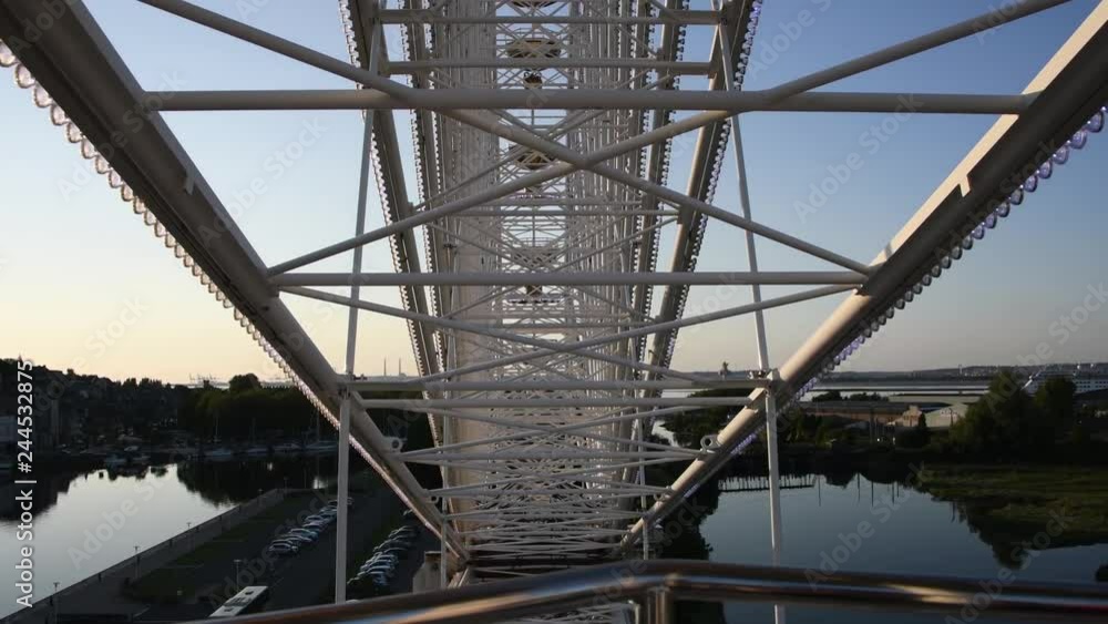 Inside a iant ferris wheel with clear blue sky, Honfleur, Normandy, France Inside a iant ferris wheel with clear blue sky, Honfleur, Normandy, France