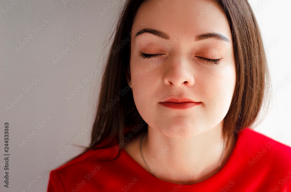 portrait beautiful young slim woman dressed in a bright red dress with a skirt. Poses for a photo in an old-fashioned room with an old decor portrait beautiful young slim woman dressed in a bright red dress with a skirt. Poses for a photo in an old-fashioned room with an old decor