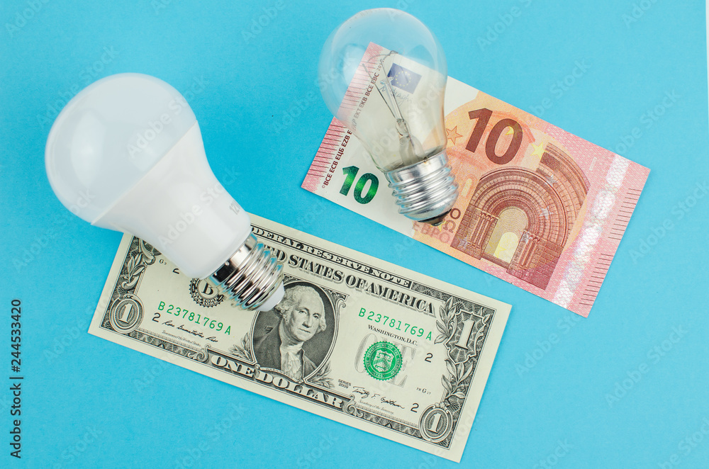incandescent lamp and energy saving on a blue background incandescent lamp and energy saving on a blue background