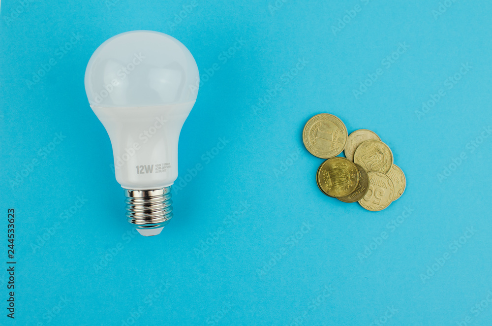incandescent lamp and energy saving on a blue background incandescent lamp and energy saving on a blue background