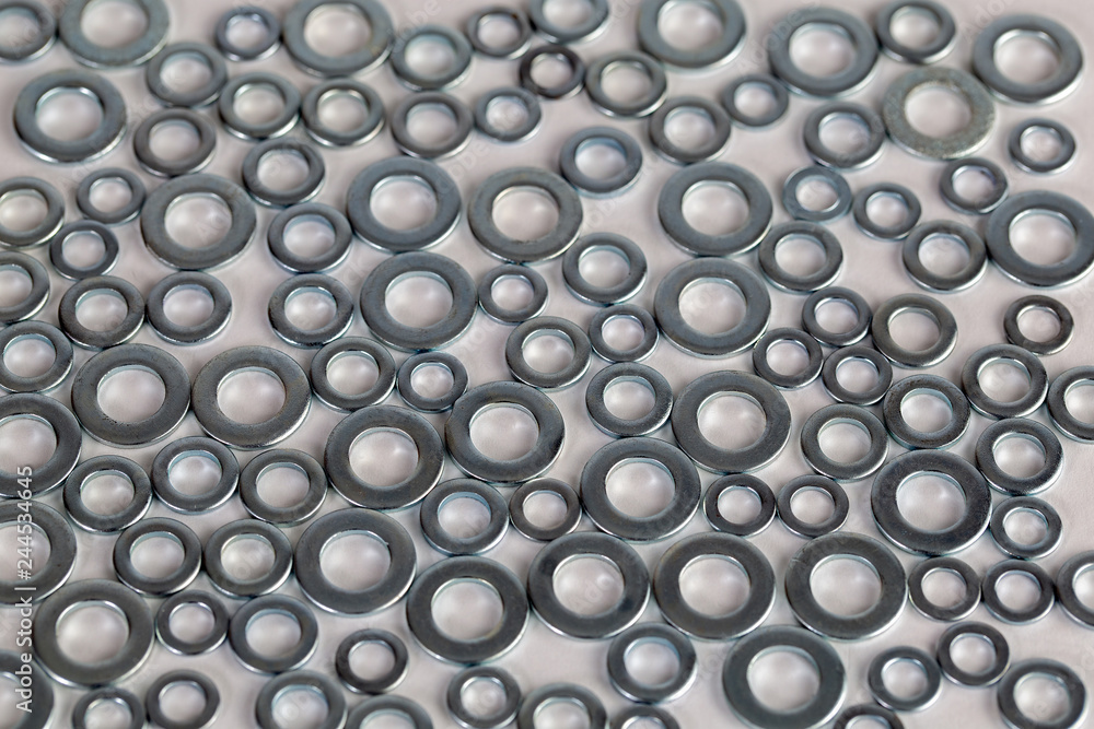 Washers arranged in pattern covering image Washers arranged in pattern covering image