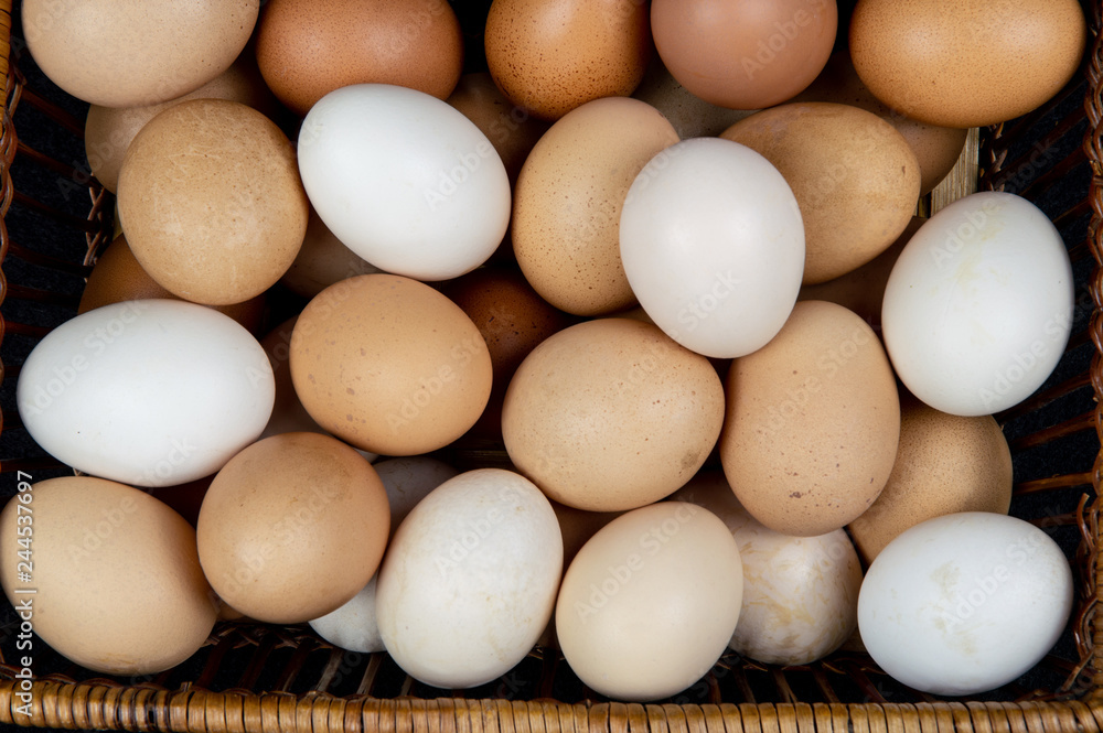 Top view of chicken eggs in a basket Top view of chicken eggs in a basket