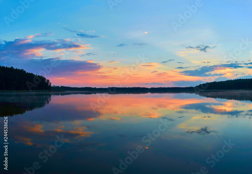 Fototapeta Naklejka Na Ścianę i Meble -  Beautiful panoramic view of the sunset over Lemiet lake in Mazury district, Poland. Fantastic travel destination.