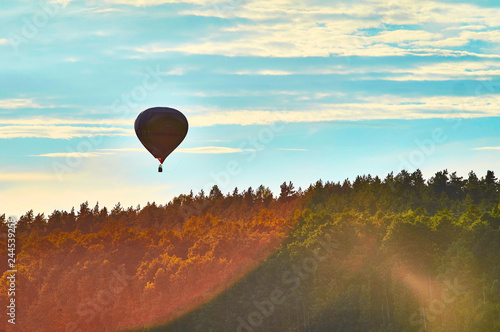 Fototapeta Naklejka Na Ścianę i Meble -  Beautiful view of flying balloon over the Lemiet lake in Mazury district, Poland. Fantastic travel destination.