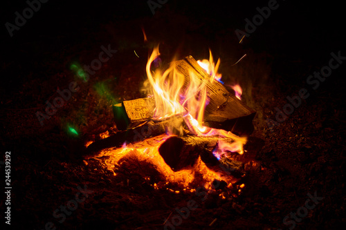 Fototapeta Naklejka Na Ścianę i Meble -  Beautiful night bonfire over Lemiet lake in Mazury district, Poland. Fantastic travel destination.