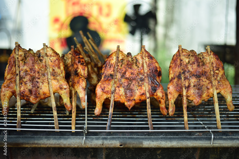 Grilled chicken with fire made from wood charcoal, street foods