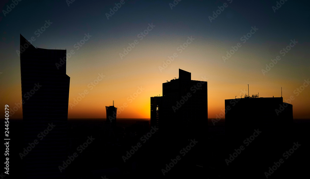Warsaw, Poland - August 27, 2016: Aerial panoramic view to downtown of Polish Capital at sunset, from the top Palace Culture and Science: Palac Kultury i Nauki, also abbreviated PKiN.