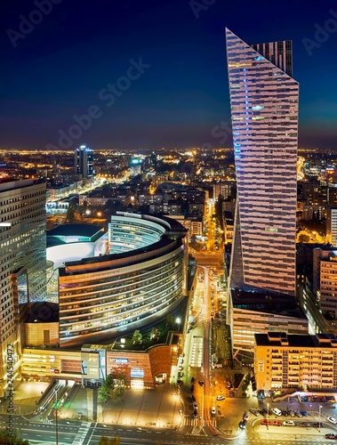 Warsaw, Poland - August 27, 2016: Aerial panoramic view to downtown of Polish Capital by night, from the top Palace Culture and Science: Palac Kultury i Nauki, also abbreviated PKiN.