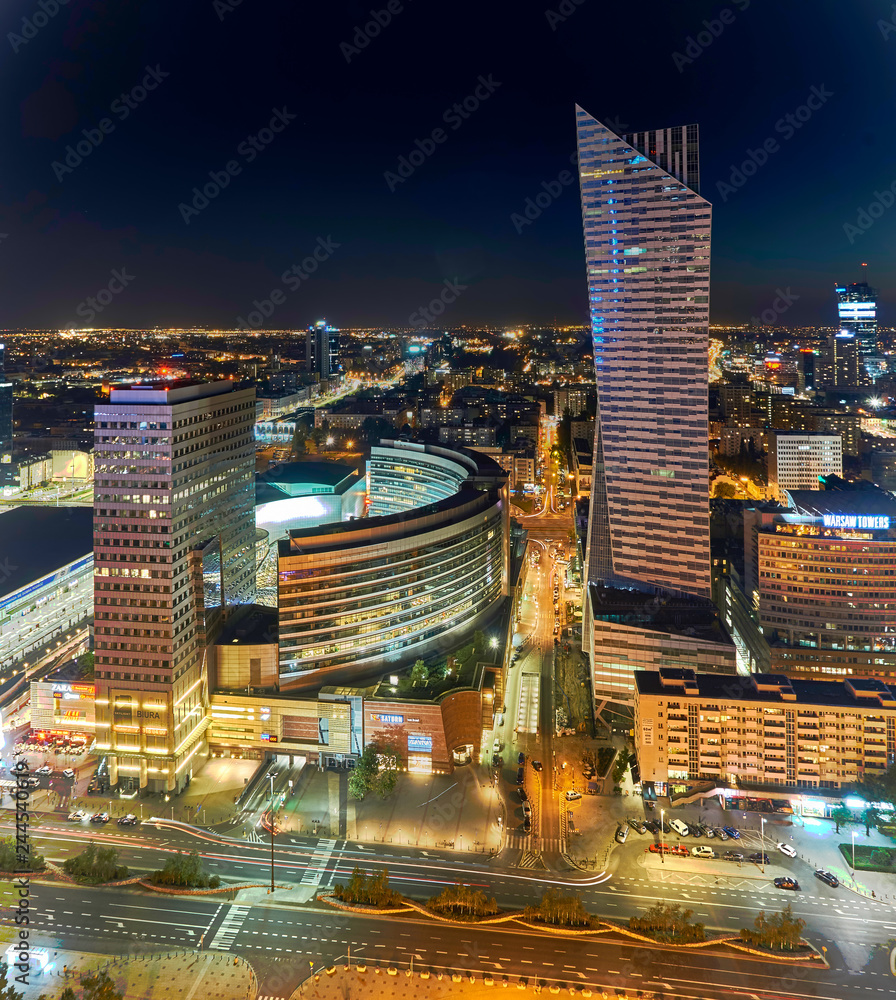 Obraz Warsaw, Poland - August 27, 2016: Aerial panoramic view to downtown of Polish Capital by night, from the top Palace Culture and Science: Palac Kultury i Nauki, also abbreviated PKiN.