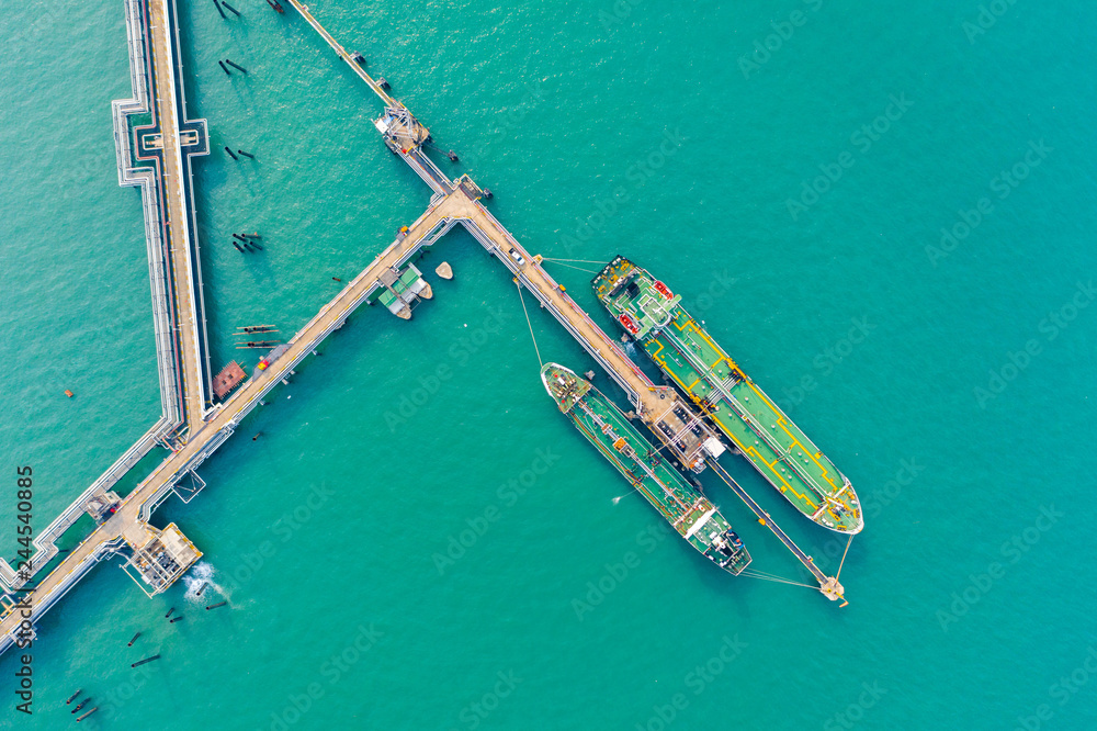 Aerial top view of the ship carrying the lpg and oil tanker in the sea port. For energy export and import business for transportation