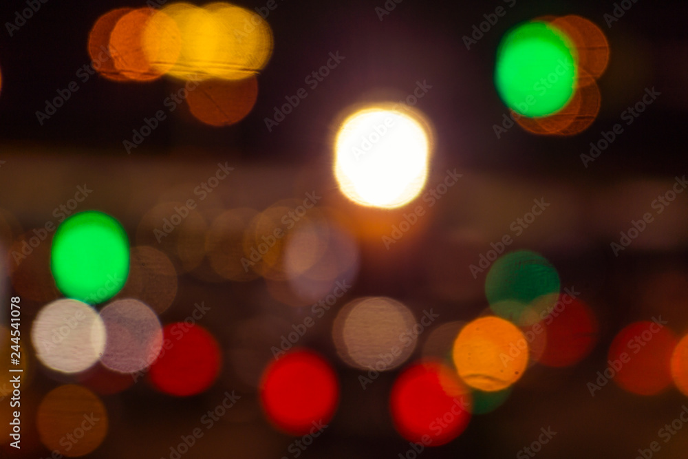Blurred background - night street with car headlights