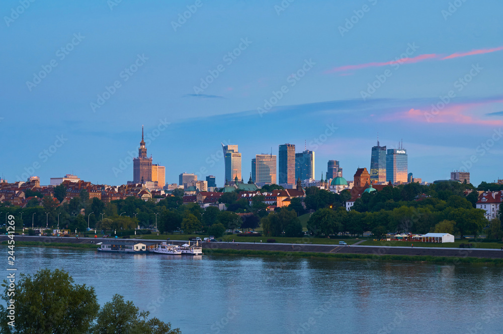 Warsaw, Poland - May 25, 2016: Sunset in the center of Capital City with skyscrapers and historical old town