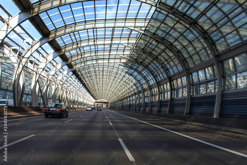 Expressway in Warsaw. Glass tunnel on the highway Expressway in Warsaw. Glass tunnel on the highway