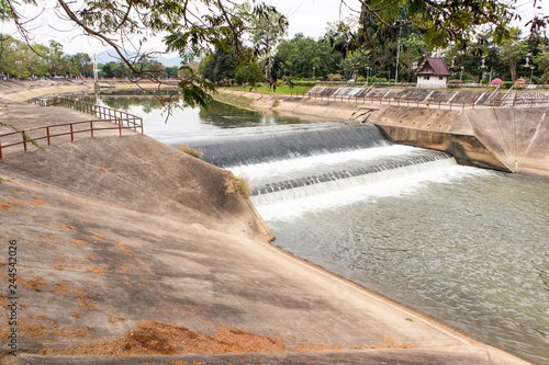 water flowing from small dam photo