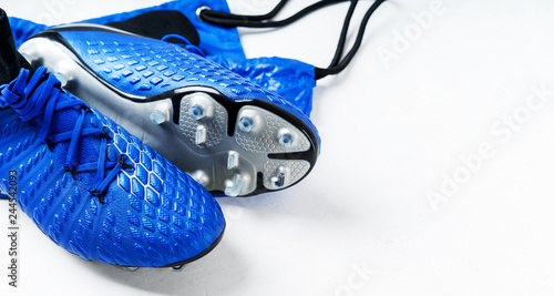 Pair of football soccer boots cleats shoes on a white background. Frame Football theme Long wide banner with copy space background.