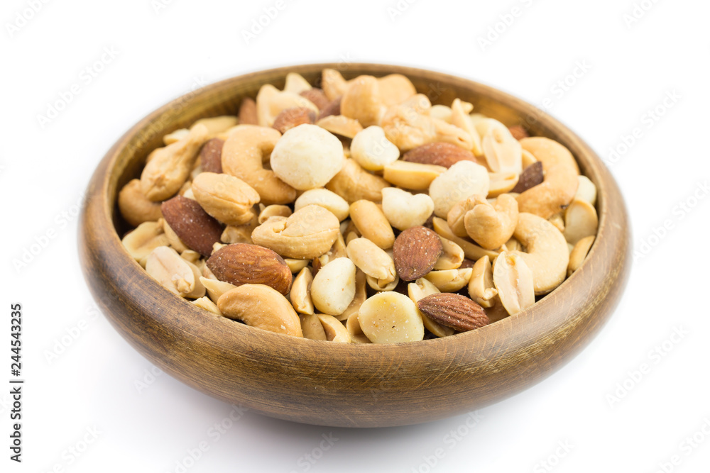 Mixed nuts in a bowl on a white background Mixed nuts in a bowl on a white background